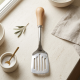 Steel spoon with a wooden handle