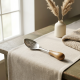 Steel spoon with a wooden handle