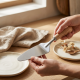 Steel spoon with a wooden handle