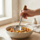 Steel spoon with a wooden handle